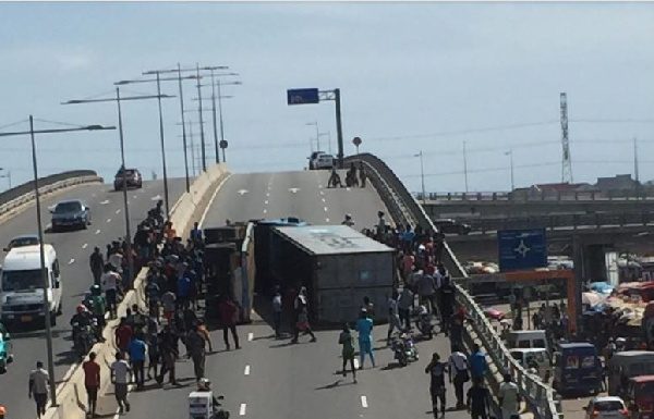 Cargo truck falls on its side on Kwame Nkrumah interchange